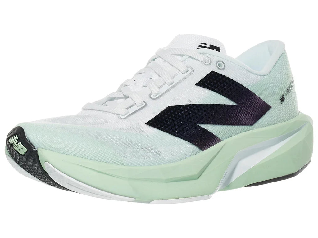 Women's New Balance Rebel v4. Light Green upper. Light Green midsole. Lateral view.
