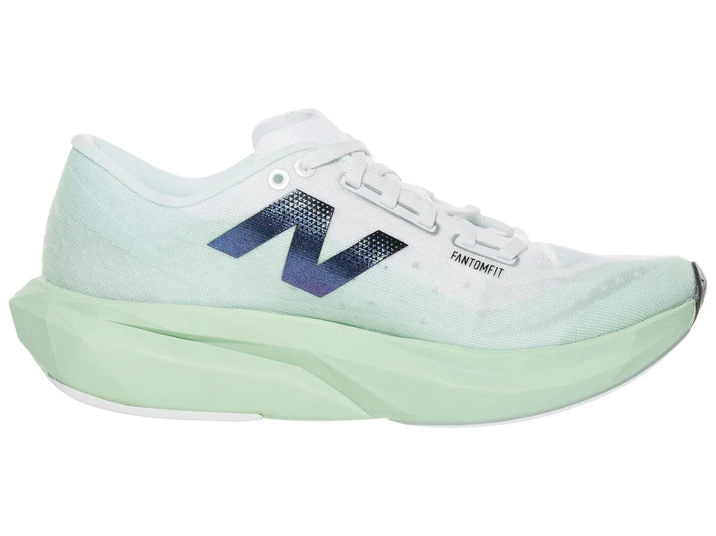 Women's New Balance Rebel v4. Light Green upper. Light Green midsole. Medial view.