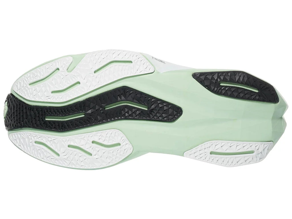 Women's New Balance Rebel v4. Light Green upper. Light Green midsole. Bottom view.
