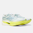 Women's New Balance SuperComp Elite v6. White upper. Yellow midsole. Lateral view.