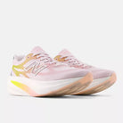 Women's New Balance Supercomp Rebel. Pink upper. White midsole. Lateral view.