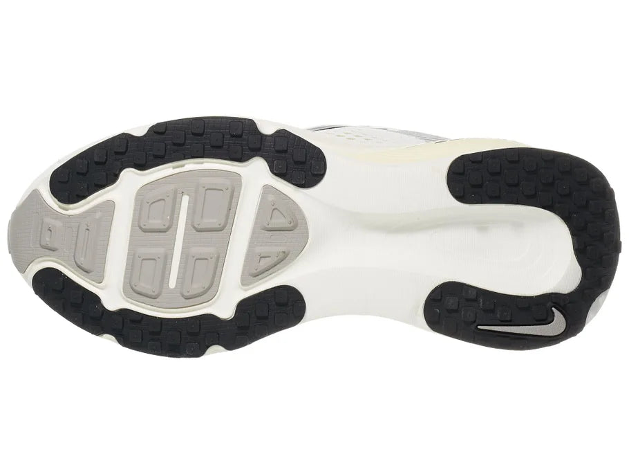 Women's Nike Vomero 18. White upper. Off White midsole. Bottom view.