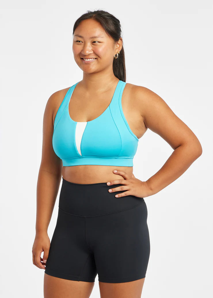 Women's Oiselle Double Breasted Bra. Blue/Green. Front view.