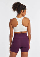 Women's Oiselle Double Breasted Bra in White, rear view.