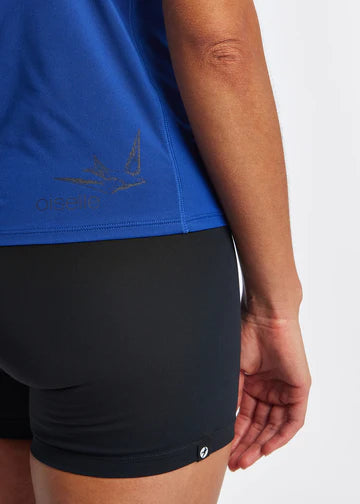 Women's Oiselle Essential Bird V Neck Short Sleeve. Dark Blue. Fabric/logo closeup.