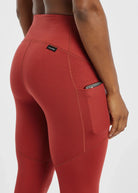 Women's Oiselle Flyout Tights in Redwood red, rear detail.