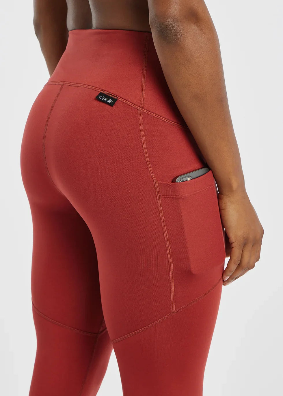 Women's Oiselle Flyout Tights in Redwood red, rear detail.