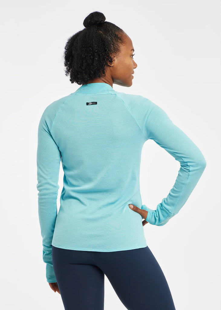Women's Oiselle Flyout Wool Long Sleeve. Light Blue. Rear view.
