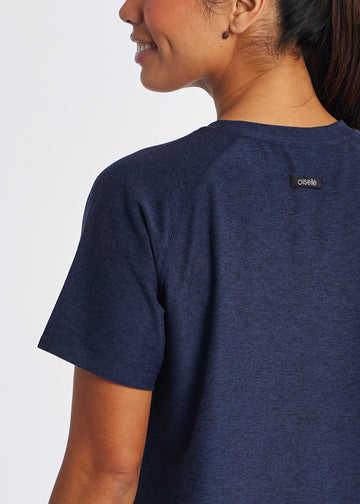 Women's Oiselle Lux Boxy Short Sleeve. Dark Blue. Rear closeup.