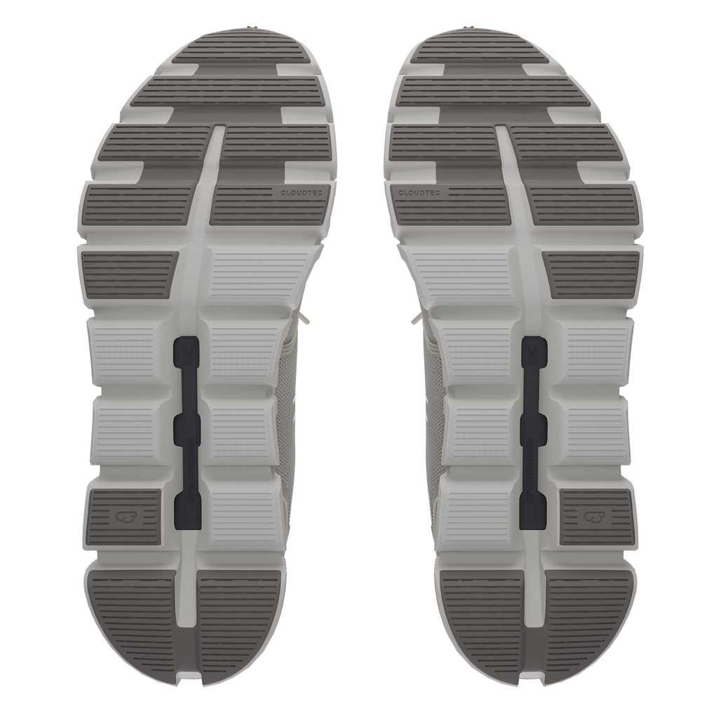 Women's On Cloud 6. Light Tan upper. White midsole. Bottom view.