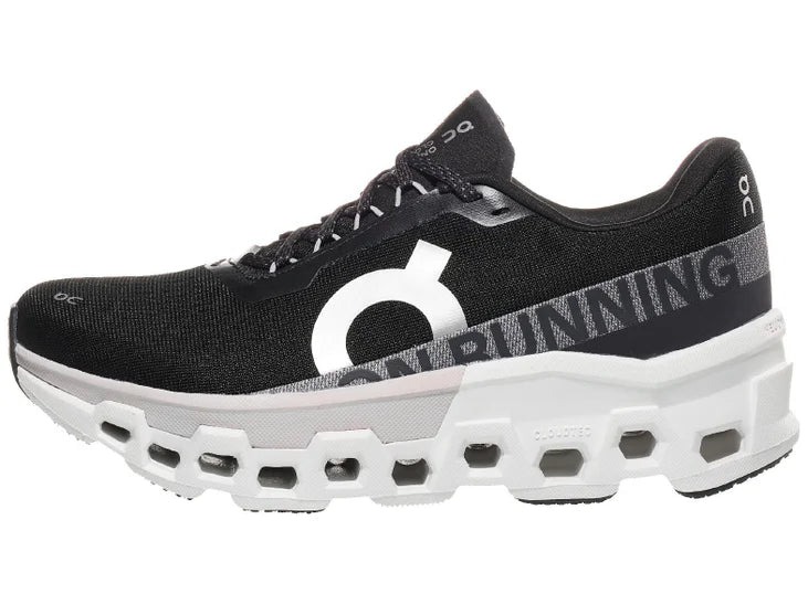 Women's On Cloudmonster 2. Black upper. White midsole. Lateral view.
