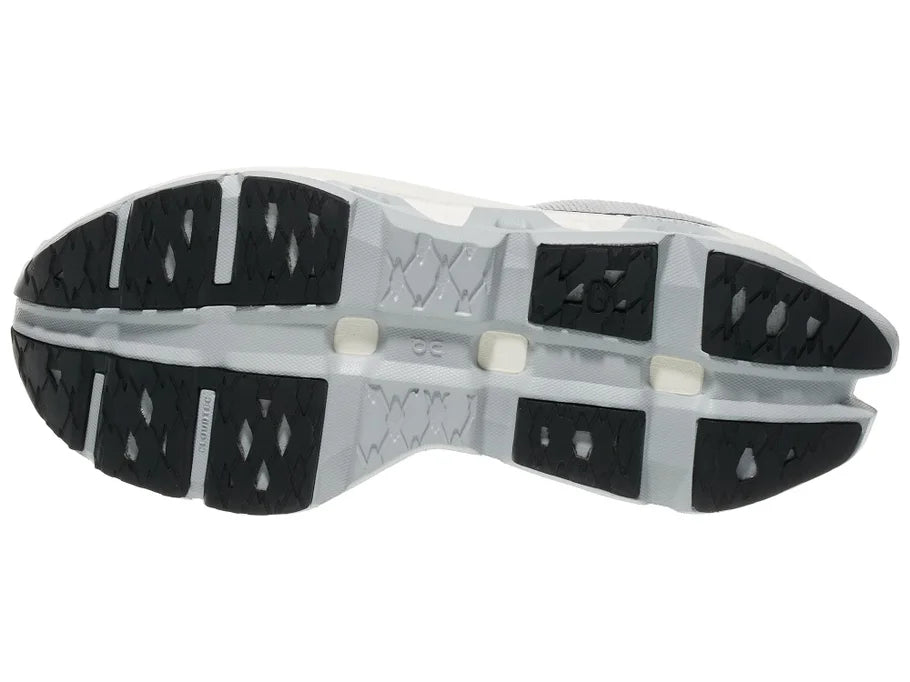 Women's On Cloudmonster Hyper. Light Grey upper. White midsole. Bottom view.