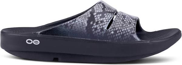 Women's Oofos OOahh Limited Slide. Grey and black snake pattern upper. Black midsole. Lateral view.