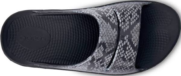 Women's Oofos OOahh Limited Slide. Grey and black snake pattern upper. Black midsole. Top view.;