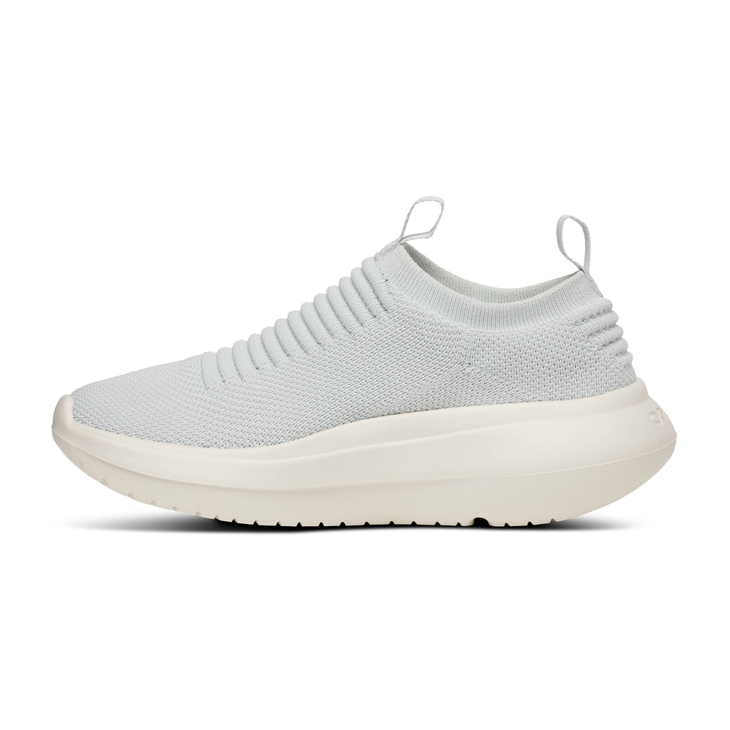 Women's Oofos Oomy Zen. White upper. White midsole. Medial view.