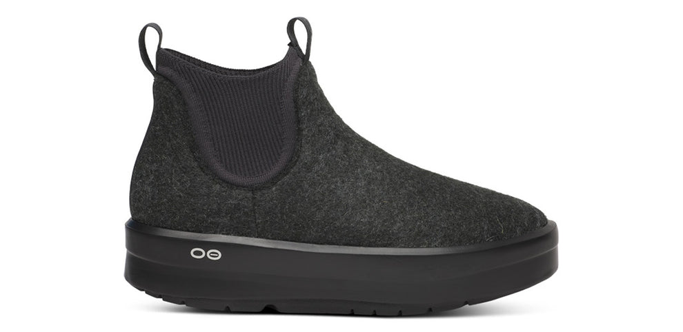Women's Oofos Londoner Boot. Black upper. Black midsole. Lateral view.