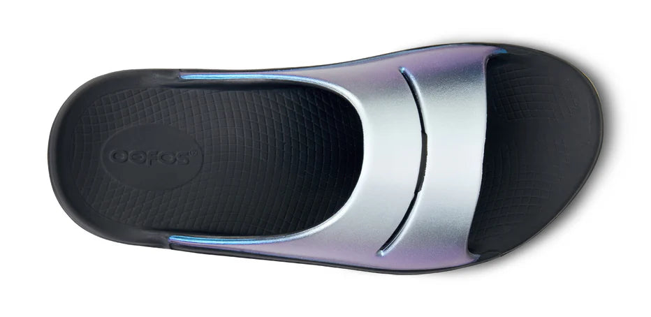 Women's Oofos Ooahh Luxe Slide. Blue Strap. Black midsole. Top view.