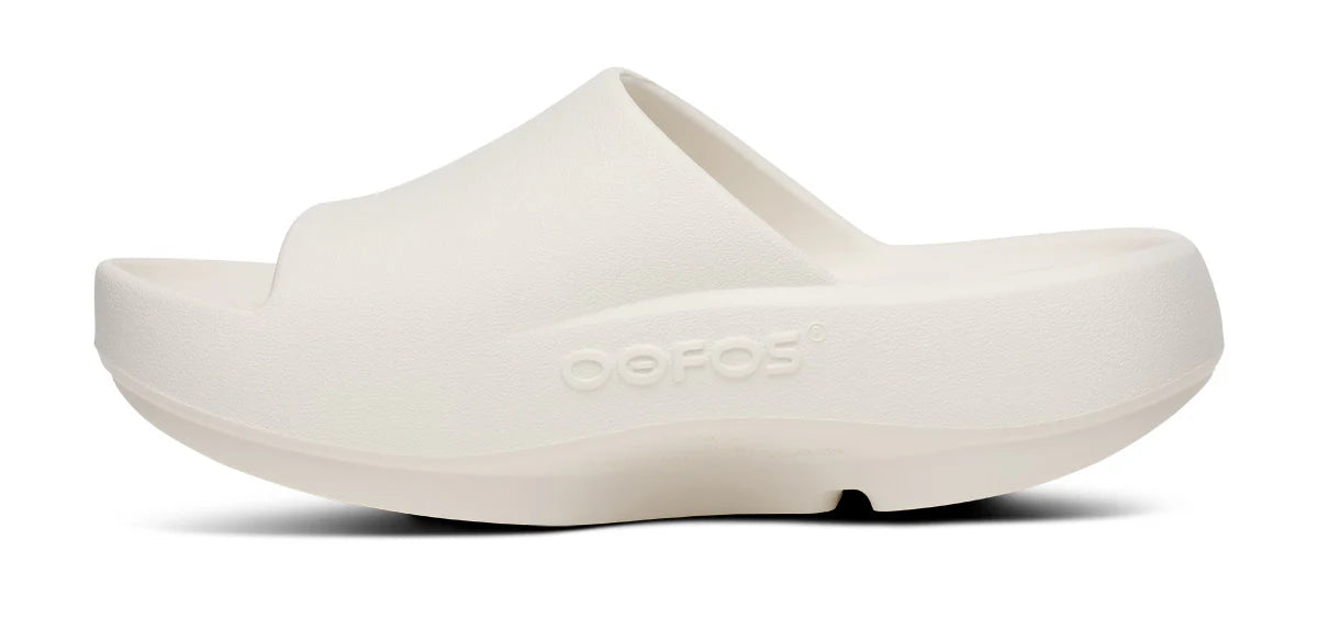 Oofos Ooahh PLUS slide. White. Medial view.