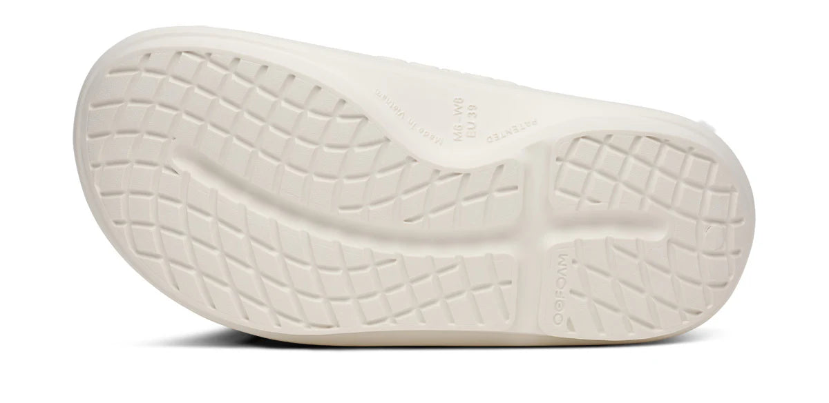 Oofos Ooahh PLUS slide. White. Bottom view.