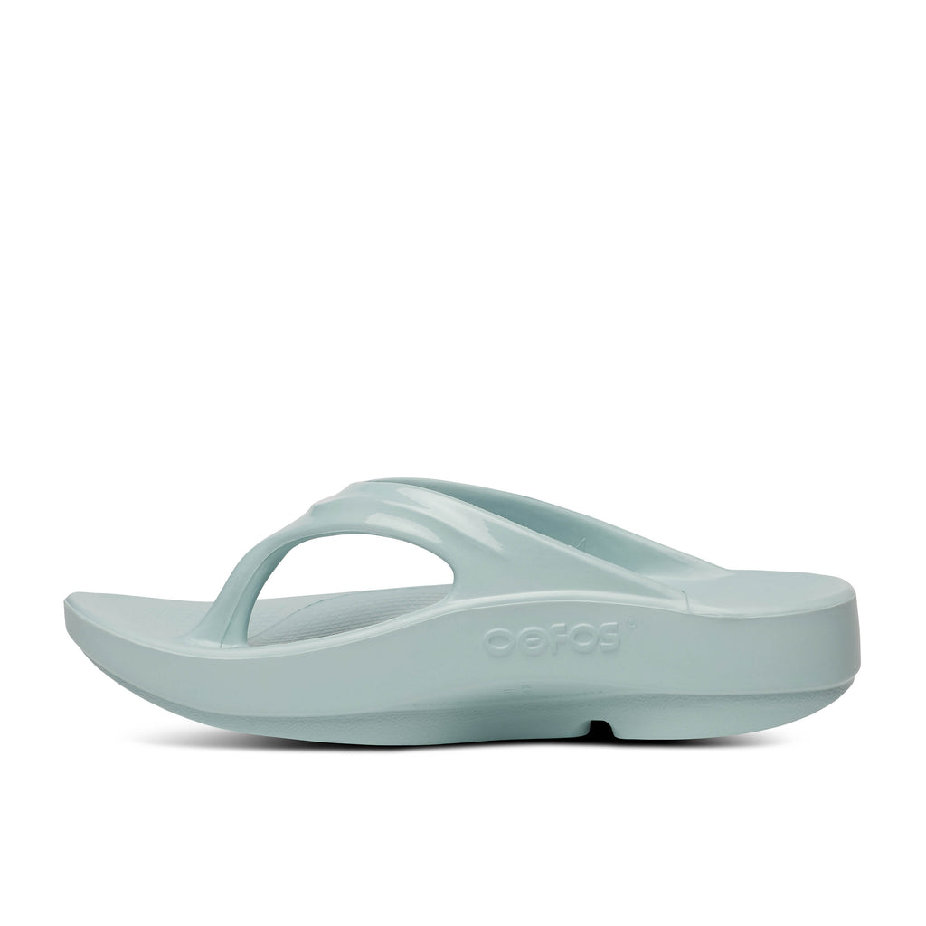 Women's Oofos Oolala Thong. Light blue. Medial view.