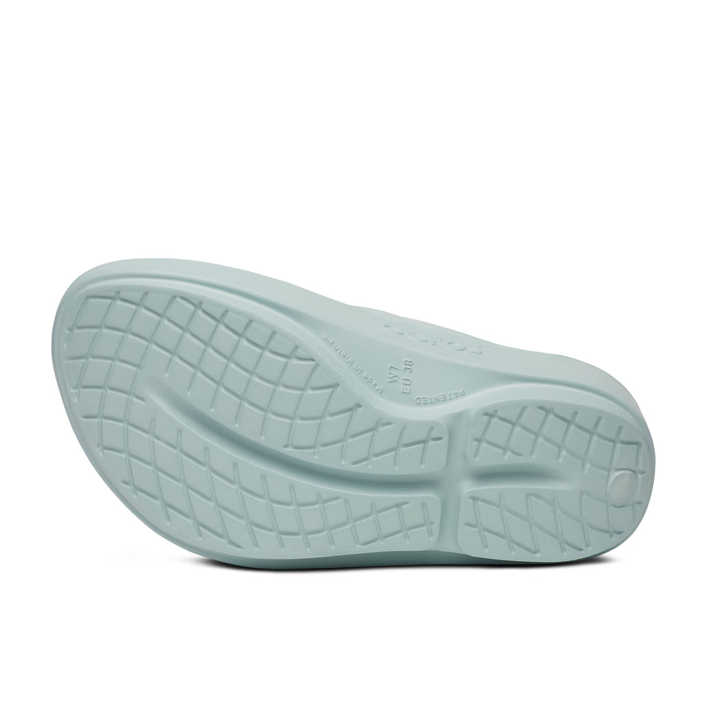 Women's Oofos Oolala Thong. Light blue.  Bottom view.