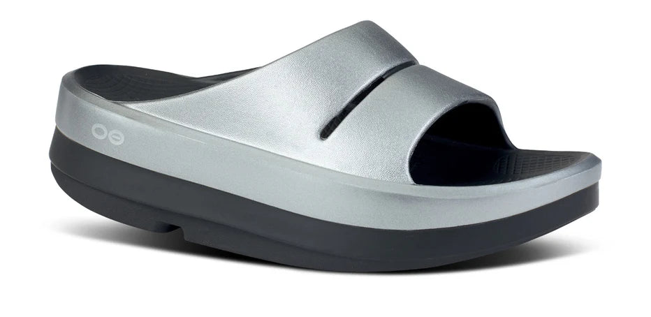 Women's Oofos OOmega Ooahh Sandal. Grey upper. Black midsole. Lateral view.