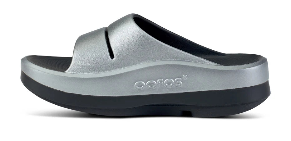 Women's Oofos OOmega Ooahh Sandal. Grey upper. Black midsole. Medial view.
