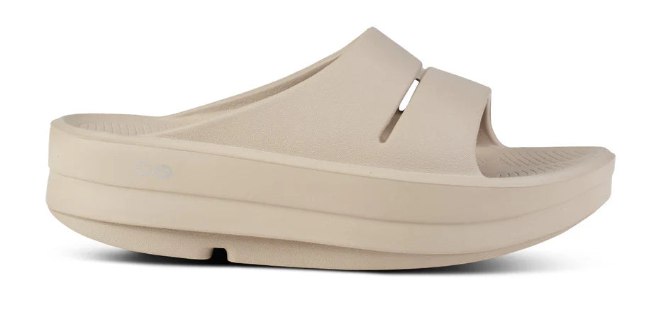 Women's Oofos Oomega Ooahh Slide. Tan. Lateral view.