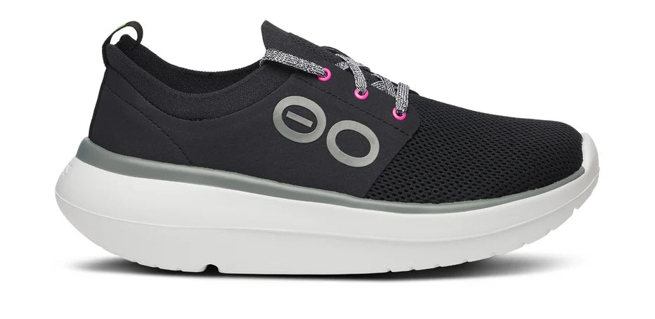 Women's Oofos OOmy Stride. Black upper. White midsole. Lateral view.