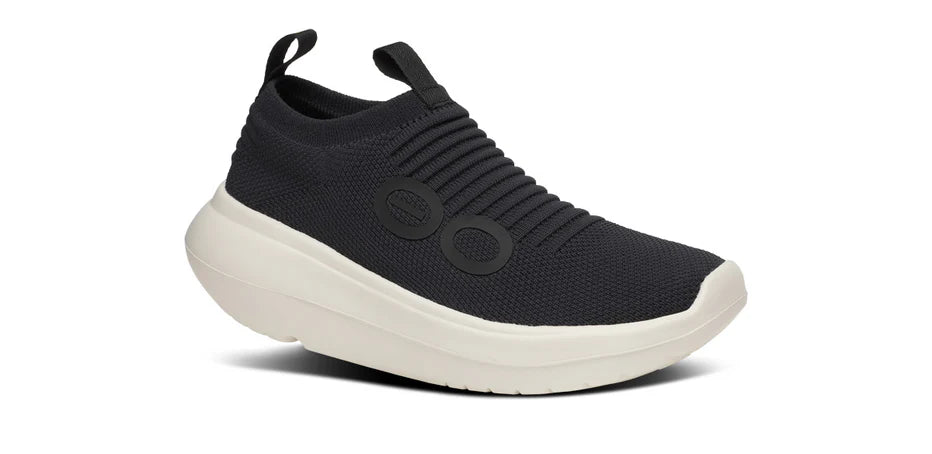 Women's Oofos OOmy Zen. Black upper. White midsole. Lateral view.