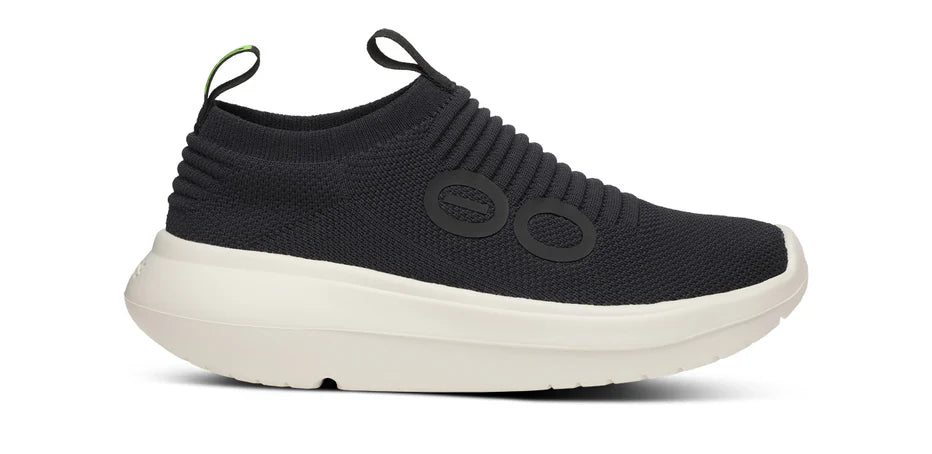 Women's Oofos OOmy Zen. Black upper. White midsole. Lateral view.