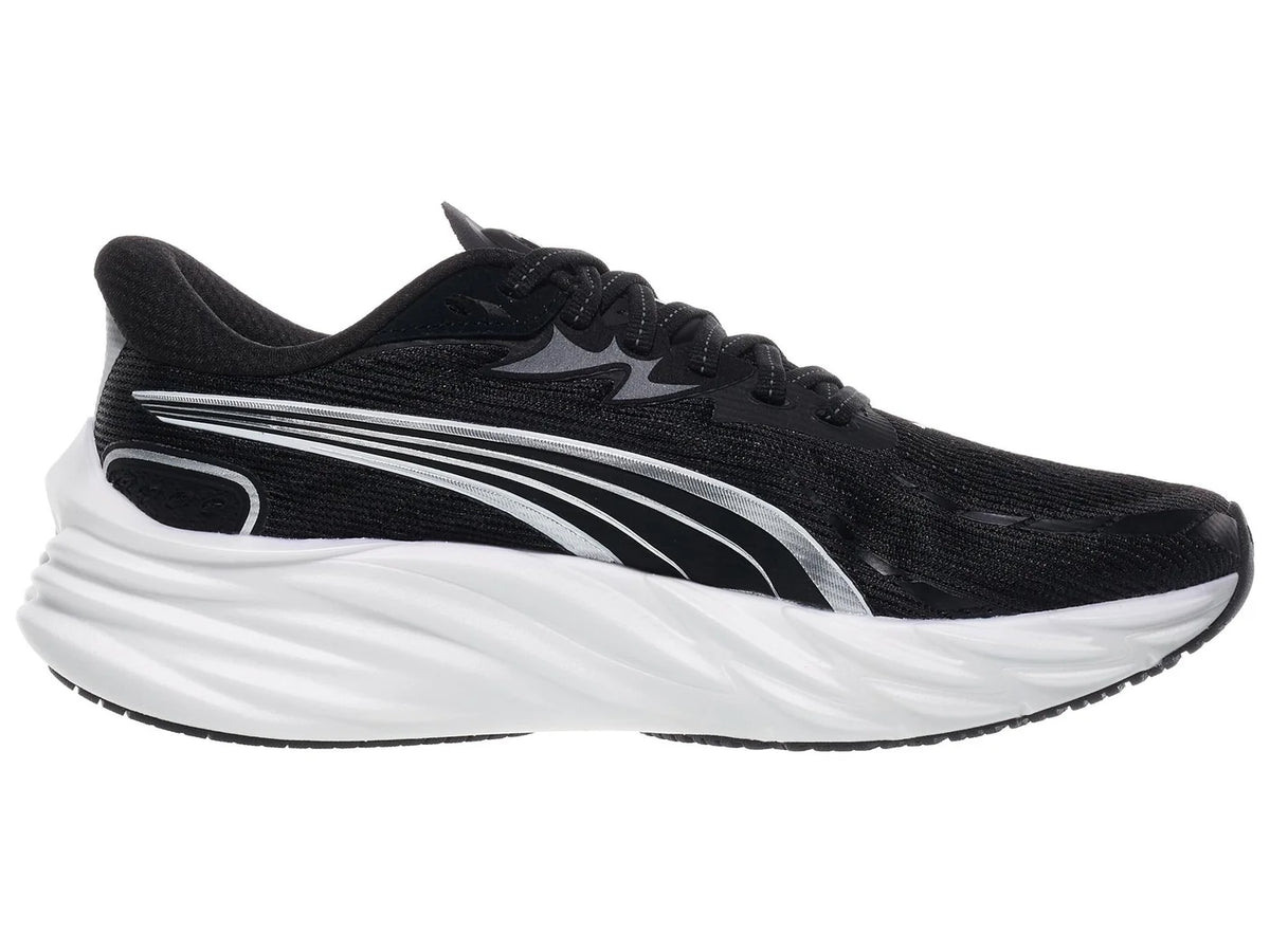 Women's Puma Velocity Nitro 4. Black upper. White midsole. Medial view.