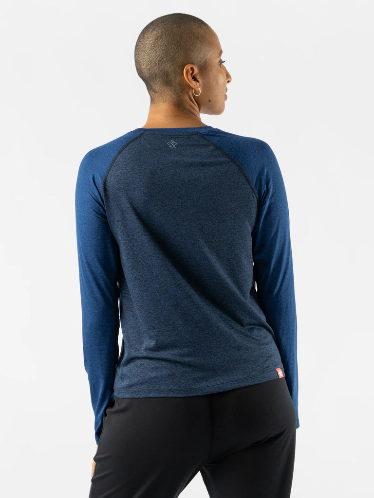 Women's rabbit EZ long sleeve cropped. Dark Blue. Rear view.