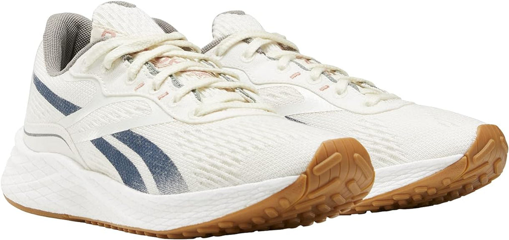 Women's Reebok Floatride Energy Grow. White upper. White midsole. Lateral view.