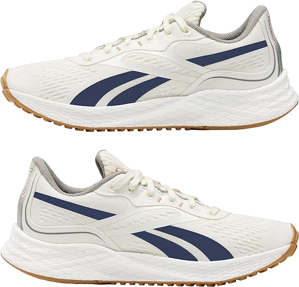 Women's Reebok Floatride Energy Grow. White upper. White midsole. Lateral & Medial view.