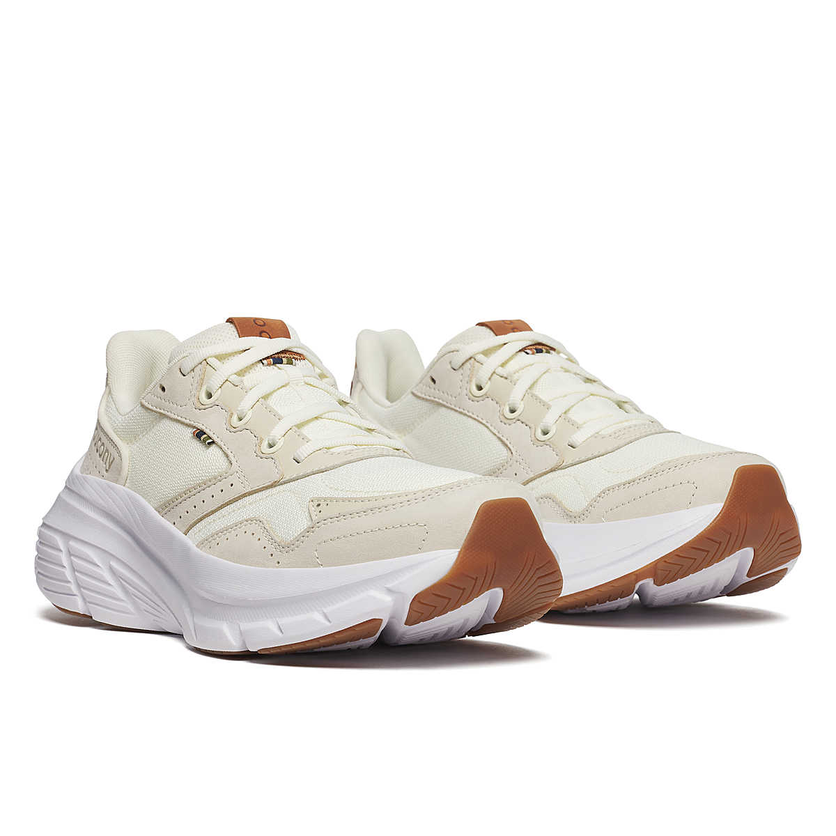 Women's Saucony Guide Metro. Beige upper. White midsole. Lateral view.