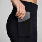 Women's Saucony RunShield Tights. Black. Side pocket closeup.