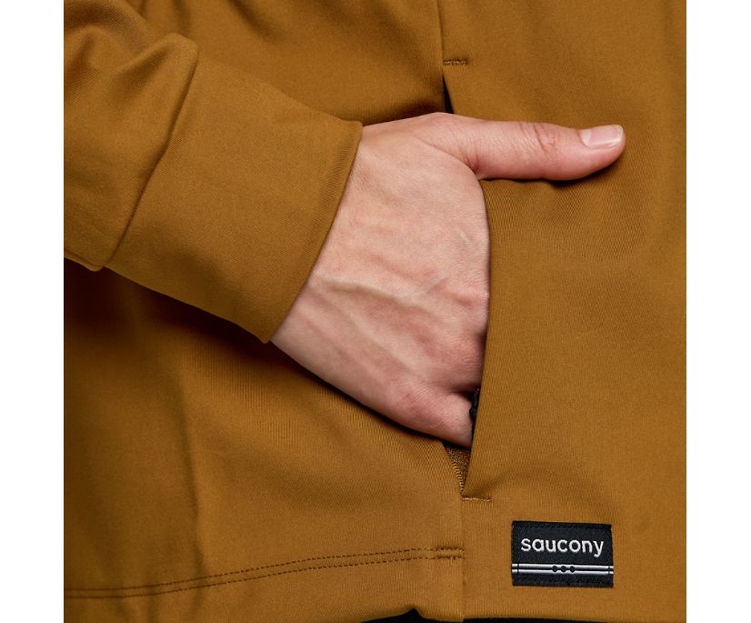 Women's Saucony Solstice Oysterpuff Half Zip. Tan/Brown. Pocket closeup.