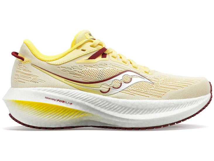Women's Saucony Triumph 21. Off Yellow upper. White midsole. Lateral view.