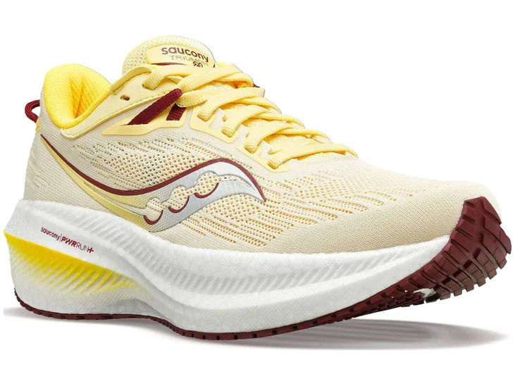 Women's Saucony Triumph 21. Off Yellow upper. White midsole. Lateral view.