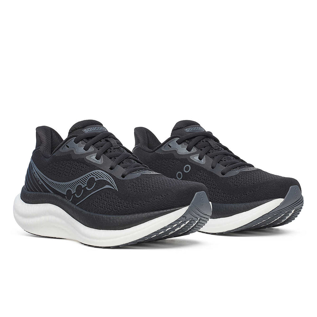 Women's Saucony Triumph 23. Black upper. White midsole. Lateral view.