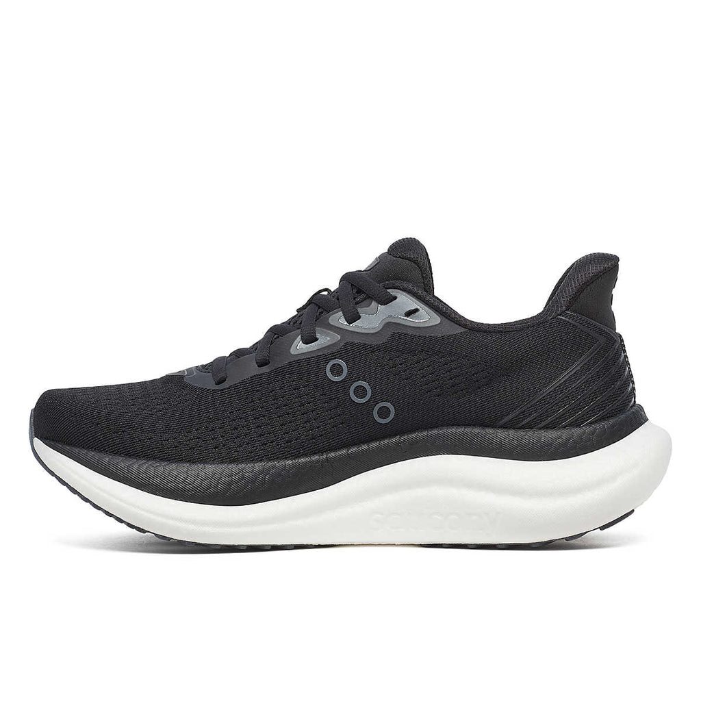 Women's Saucony Triumph 23. Black upper. White midsole. Medial view.