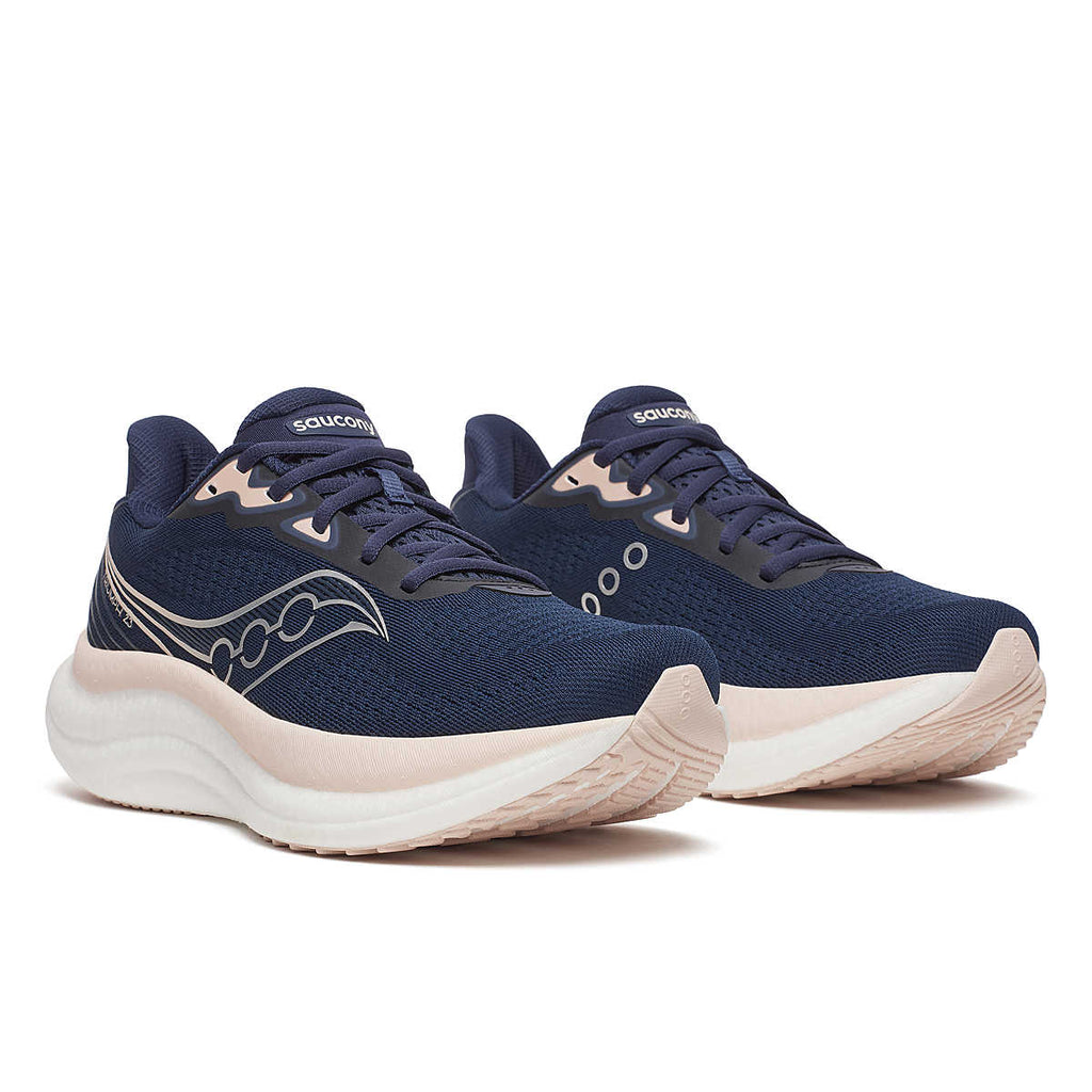 Women's Saucony Triumph 23. Navy upper. White midsole. Lateral view.
