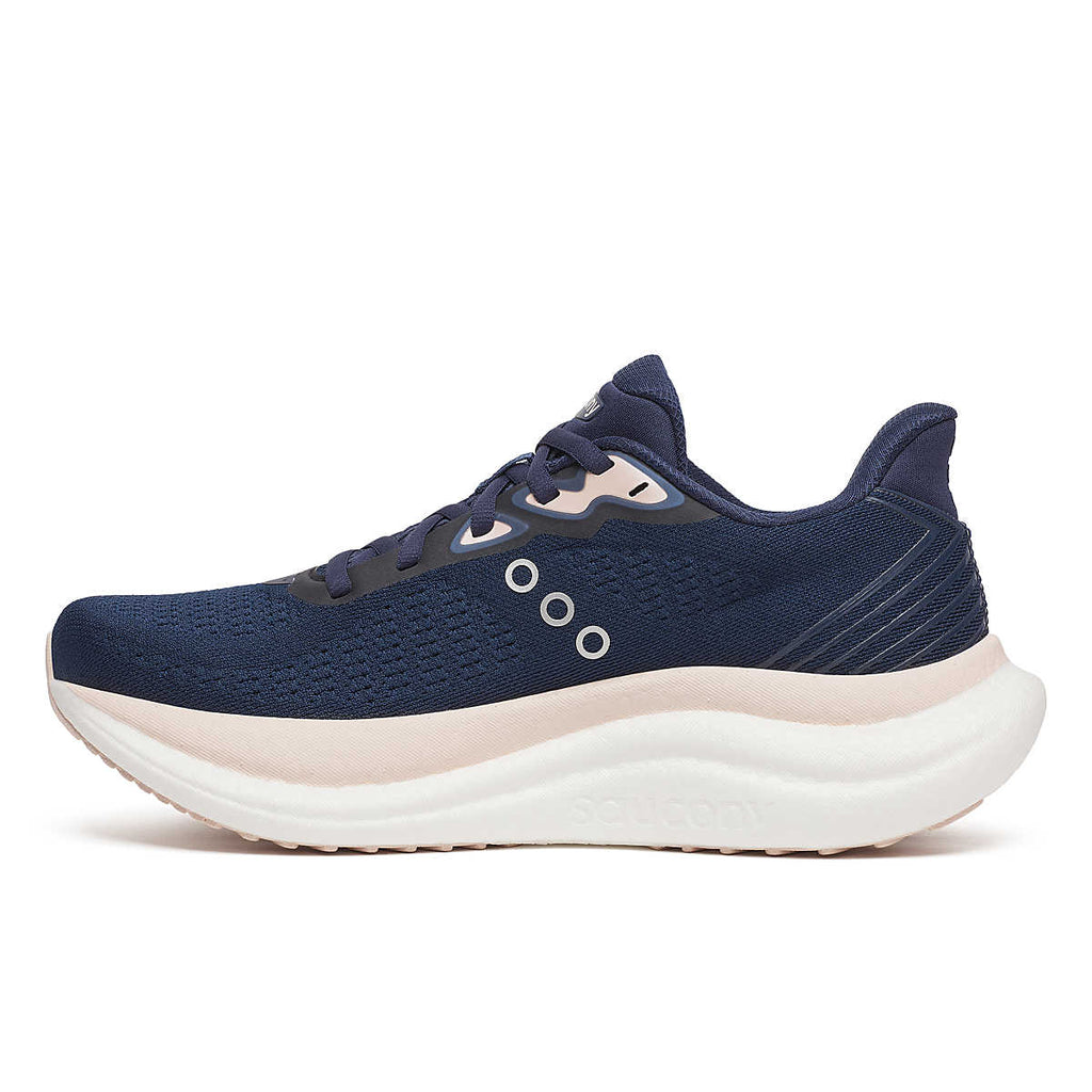 Women's Saucony Triumph 23. Navy upper. White midsole. Medial view.