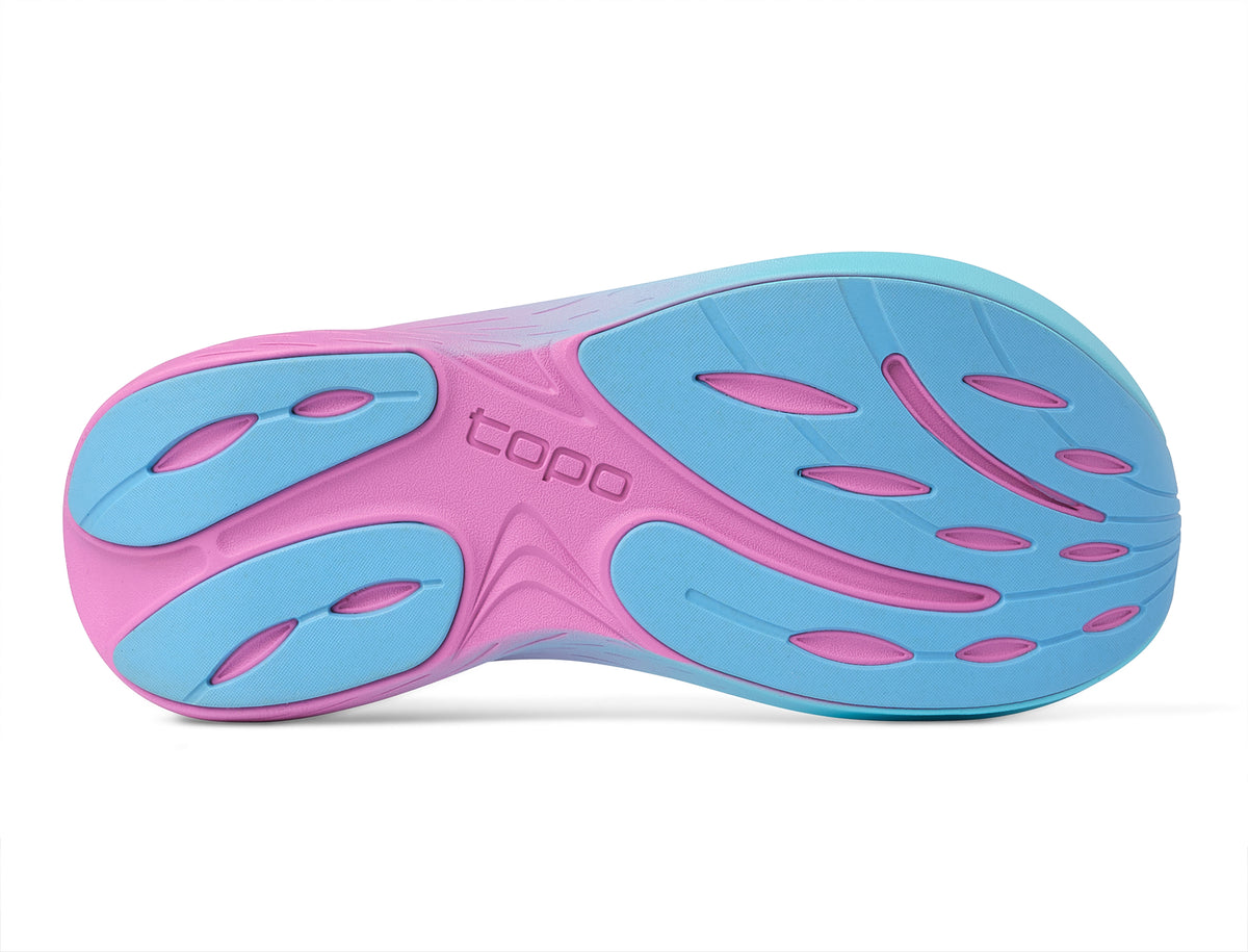 Women's Topo Atmos 2. White upper. Pink/Blue midsole. Bottom view.