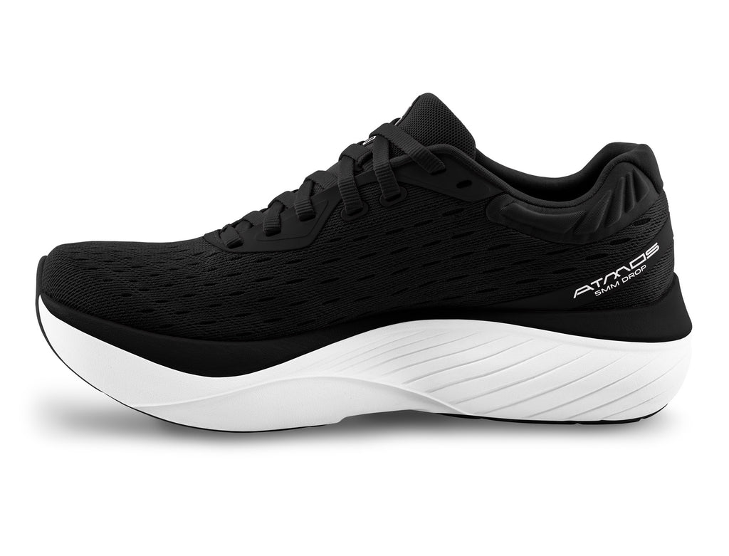 Women's Topo Atmos. Black upper. White midsole. Medial view.