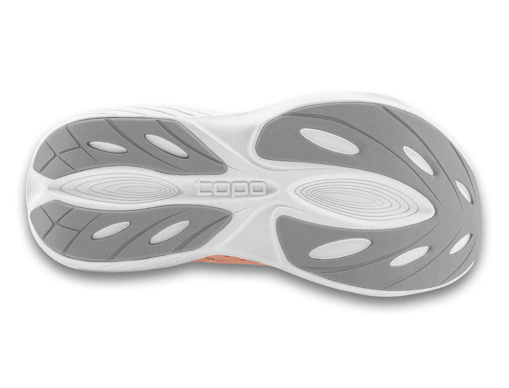 Women's Topo Atmos. Pink upper. White midsole. Bottom view.