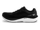 Women's Topo Magnifly 6. Black upper. White midsole. Medial view.