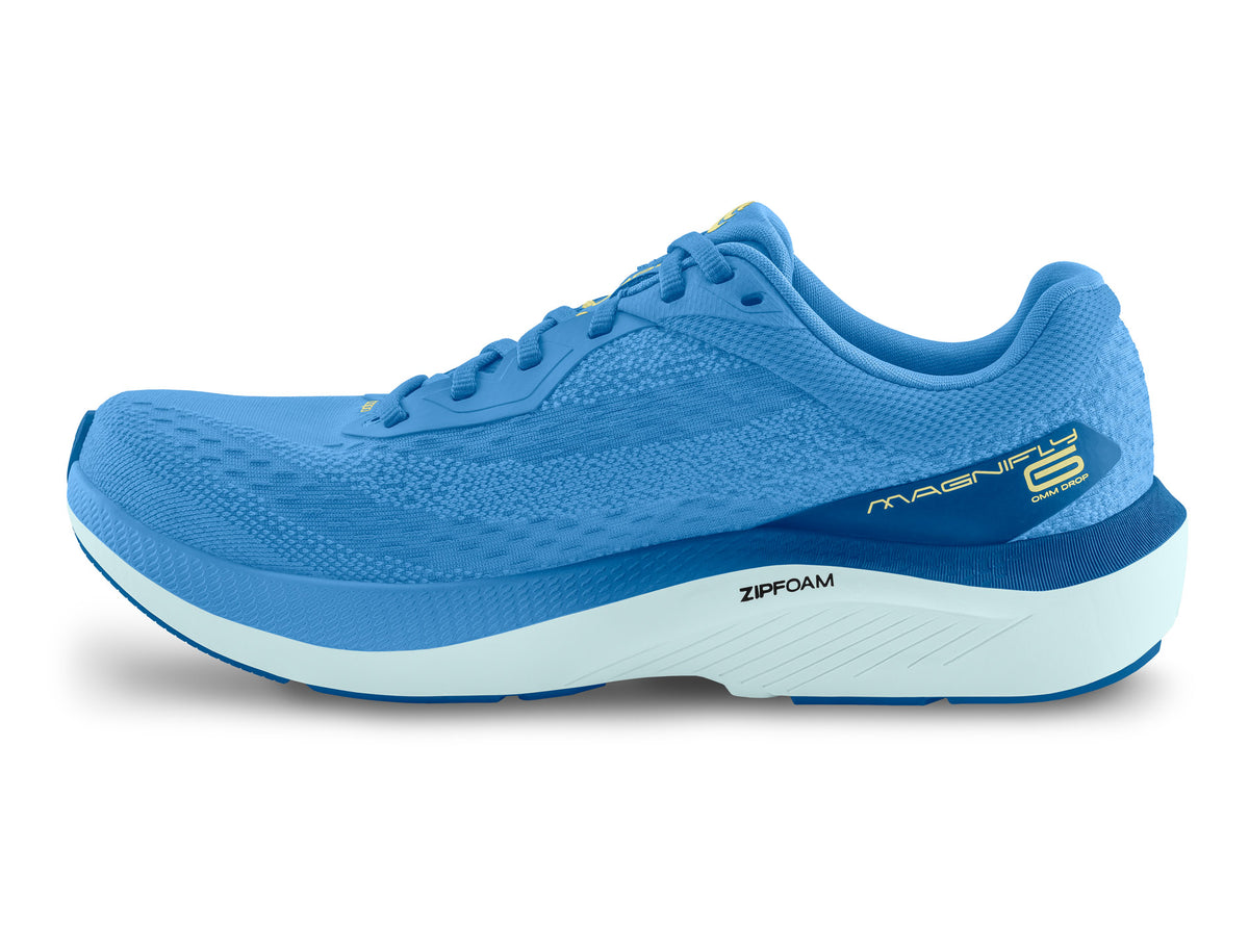 Women's Topo Magnifly 6. Blue upper. White midsole. Medial view.