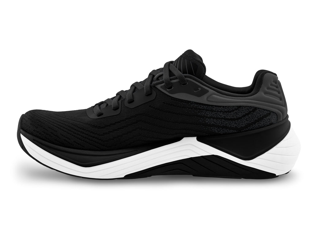 Women's Topo Ultrafly 5. Black upper. White midsole. Medial view.